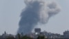 Smoke billows over southern Lebanon following an Israeli strike, amid ongoing cross-border hostilities between Hezbollah and Israeli forces, as seen from Tyre, Lebanon, Sept. 27, 2024. 