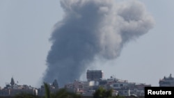 Smoke billows over southern Lebanon following an Israeli strike, amid cross-border hostilities between Hezbollah and Israeli forces, as seen from Tyre, Lebanon, Sept. 27, 2024. 