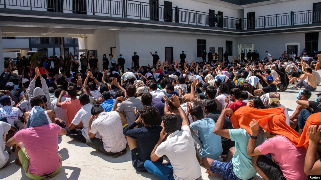 FILE - Victims of scam centers who were tricked or trafficked into working in Myanmar, stuck in limbo at a compound inside the KK Park, a fraud factory, and a human trafficking hub on the Thailand-Myanmar border in Myawaddy, Myanmar, Feb. 26, 2025.