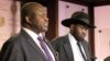 FILE - South Sudan Riek Machar, left, and Salva Kiir, South Sudan president, attend a press conference at the presidential palace in Juba, South Sudan, July 8, 2016.