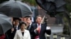 Australia's Defense Minister Richard Marles struggles with his umbrella as Japan's Defense Minister Minoru Kihara and Japan's Minister of Foreign Affairs Yōko Kamikawa look on at the 11thAustralia-Japan 2+2 Foreign and Defense Ministerial Consultation Sept. 5, 2024.