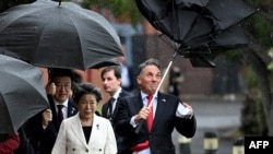 Australia's Defense Minister Richard Marles struggles with his umbrella as Japan's Defense Minister Minoru Kihara and Japan's Minister of Foreign Affairs Yōko Kamikawa look on at the 11thAustralia-Japan 2+2 Foreign and Defense Ministerial Consultation Sept. 5, 2024.