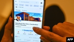 This photo illustration shows a post on Facebook by Cambodian government official Duong Dara, which includes an image of the official Facebook page of Cambodia's Prime Minister Hun Sen before he deleted his account, in Phnom Penh on June 30, 2023.