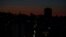 FILE - The capital city of Beirut remains in darkness during a power outage as the sun sets, in Beirut, Lebanon, March 29, 2021.