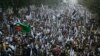 Supporters of the Pakistan Defense Council, a coalition of Islamic parties, take part in a rally to condemn U.S. drone attacks in Pakistani tribal areas, Sunday, Dec. 1, 2013 in Lahore, Pakistan.