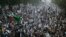 Supporters of the Pakistan Defense Council, a coalition of Islamic parties, take part in a rally to condemn U.S. drone attacks in Pakistani tribal areas, Sunday, Dec. 1, 2013 in Lahore, Pakistan.