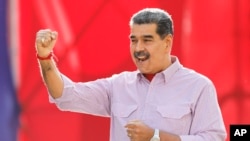 Venezuela's President Nicolas Maduro gestures to supporters during a rally in Caracas, Venezuela, Feb. 27, 2025.