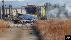 Fire engines work to extinguish a fire at the Muan International Airport in Muan, South Korea, Dec. 29, 2024.