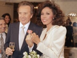 FILE - Vic Damone, left, and Diahann Carroll show off their rings after wedding in Atlantic City, N.J., Jan. 3, 1987.