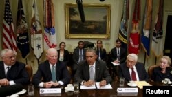 FILE - Former U.S. secretaries of state meet with President Barack Obama to discuss the Trans-Pacific Partnership at the White House in Washington, Nov. 13, 2015.