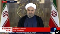 This image made from video broadcast on Press TV, Iran's English language state-run channel shows President Hassan Rouhani making a statement in Tehran following announcement of the Iran nuclear deal, July 14, 2015.