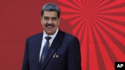 ARCHIVO - El presidente venezolano, Nicolás Maduro, sonríe al inicio de la Cumbre de la Alianza Bolivariana para los Pueblos de Nuestra América (ALBA), en Caracas, Venezuela, el 14 de diciembre de 2024.