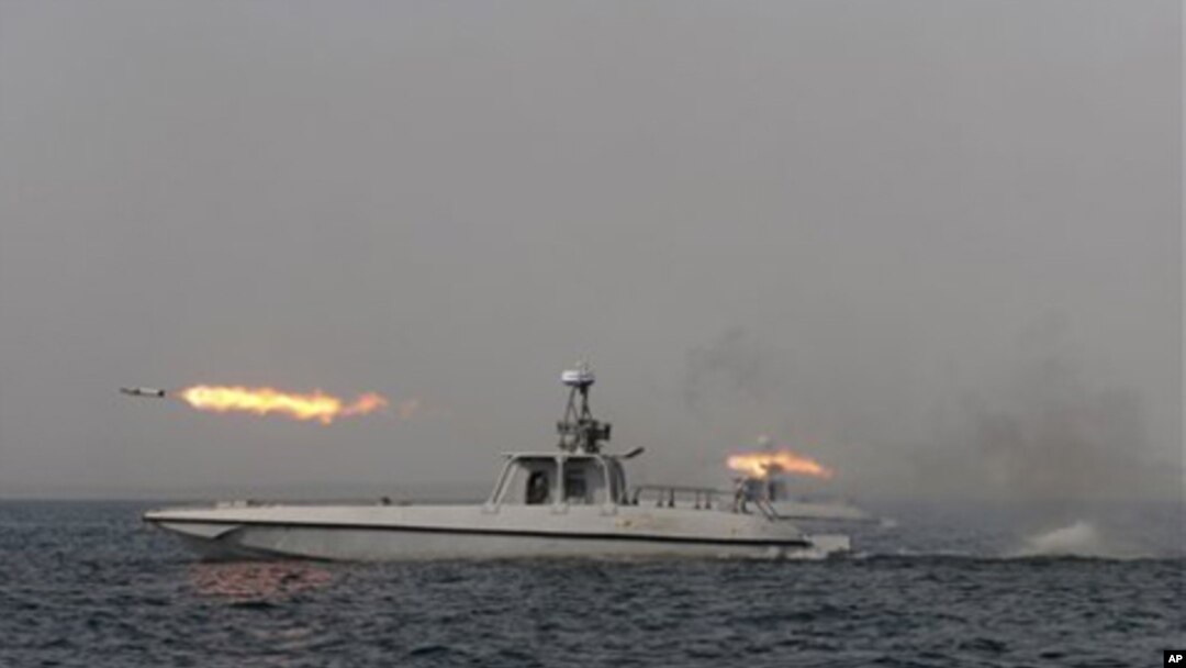 An Iranian navy boat fires a missile in a drill in the sea of Oman, December 30, 2011.
