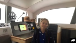 Greta Thunberg, a 16-year-old climate activist from Sweden, sits on a catamaran docked in Hampton, Virginia, Nov. 12, 2019. 