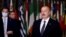 FILE — Azerbaijani President Ilham Aliyev, right, stands in Brussels on Dec. 15, 2021. Azerbaijan is set to hold snap presidential elections on Wednesday, with seven candidates vying for the top position; Aliyev is expected to secure victory.