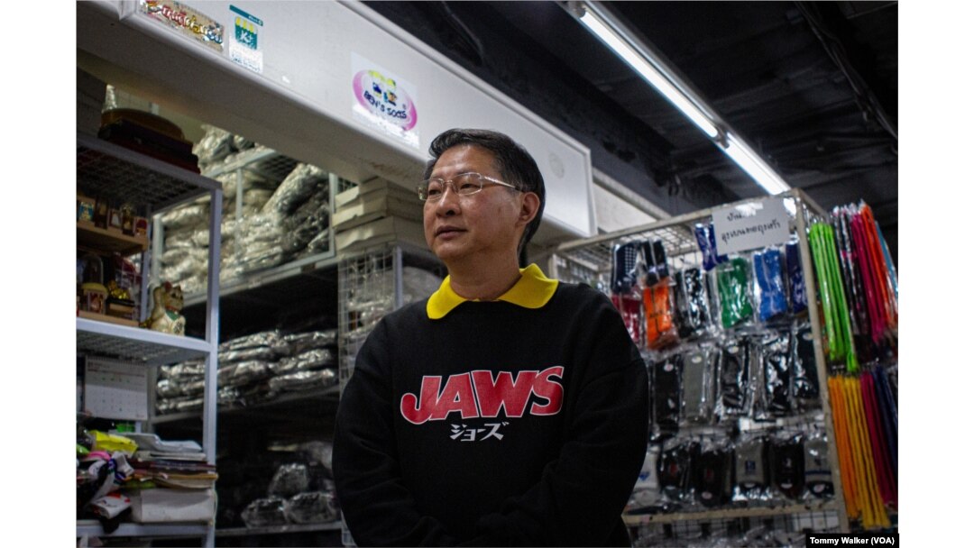 Ben’s Socks store owner Banchob Pianphanitpor says his business has seen sales reduce by half since low quality imports came into Thailand from China, in Bangkok, Dec. 17, 2024.