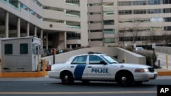 FILE - A federal law enforcement vehicle sits in front of the United State Courthouse in Baltimore. 