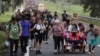 FILE - Migrants walk along the Huixtla highway in the state of Chiapas, Mexico, Oct. 22, 2024, hoping to reach the country's northern border and ultimately the United States.