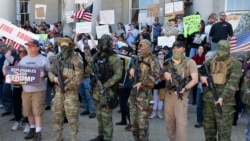 People, including those with the boogaloo movement, demonstrate against business closures due to concern about COVID-19, at the State House in Concord, N.H., May 2, 2020.