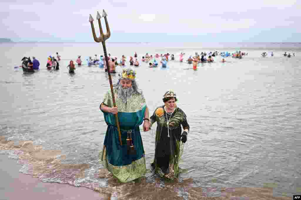 People swim in the Baltic Sea during the New Year celebrations in Gdansk, Poland.