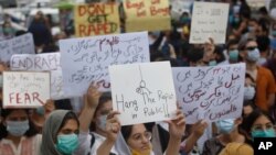 Members of civil society groups take part in a rally to condemn the incident of rape on a deserted highway, in Karachi, Pakistan, Sept. 12, 2020.