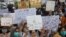 Members of civil society groups take part in a rally to condemn the incident of rape on a deserted highway, in Karachi, Pakistan, Sept. 12, 2020.