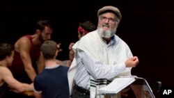 Steven Skybell, as Tevye, rehearses with the National Yiddish Theatre Folksbiene cast of a Yiddish-language production of "Fiddler on the Roof," at the at the Museum of Jewish Heritage, in New York, June 19, 2018.