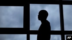 A 26-year-old gay Ugandan man, who insisted on anonymity because of fears for his safety, speaks to The Associated Press, in Nairobi, Kenya, Aug. 7, 2014. 