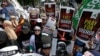Muslim protesters rally outside China's embassy in Jakarta, Indonesia, Friday, Dec. 21, 2018. Several hundred protesters chanted "God is Great" and "Get out, communist!" outside China's embassy in the Indonesian capital.