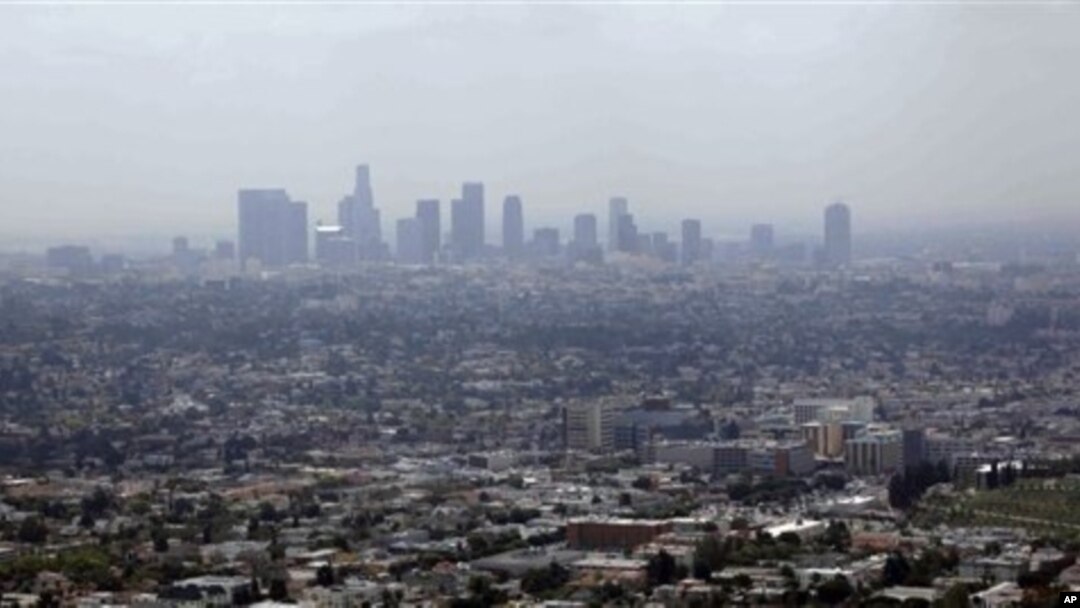 FILE - Smog from smokestacks, diesel engines, automobiles, and other sources of pollution, Los Angeles, April 2009.