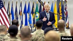 U.S. Defense Secretary Chuck Hagel speaks to members of the military during his visit to Bagram Airfield in Bagram, June 1, 2014.