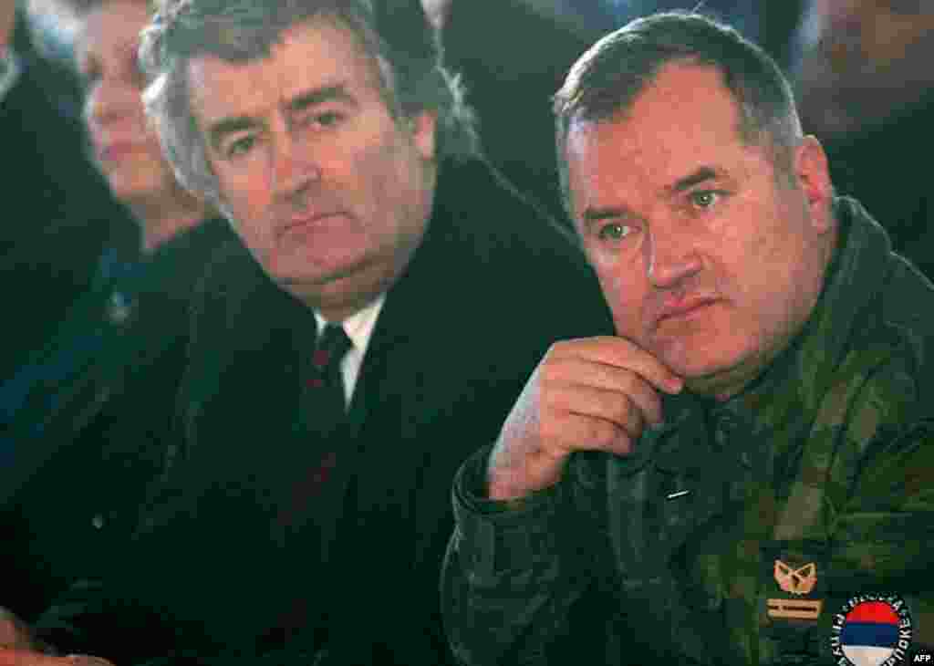 Undated file photo showing top war crimes fugitives Bosnian Serb wartime military commander Ratko Mladic, right, and political leader Radovan Karadzic. (AP Photo)