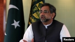 FILE - Pakistan's Prime Minister Shahid Khaqan Abbasi speaks with a Reuters correspondent during an interview at his office in Islamabad, Pakistan, Sept. 11, 2017. 