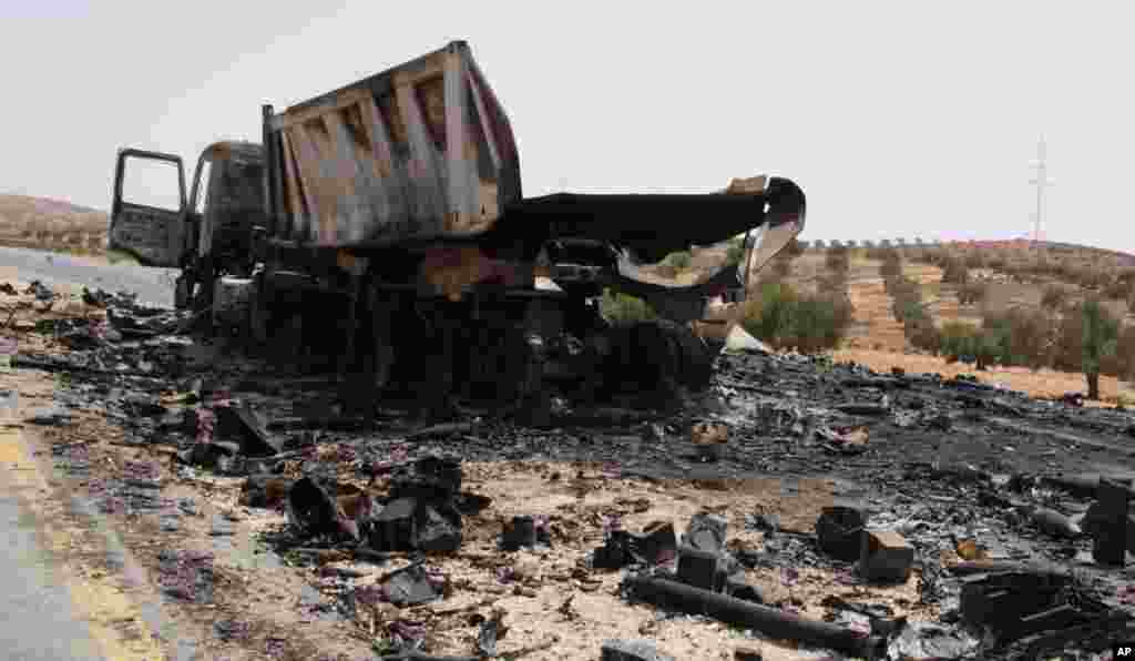 The burnt-out remains of a truck loaded with rockets. Near Tarhouna, Libya. September 4, 2011. VOA - E. Arrott