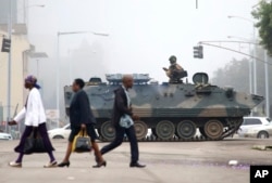 An armed soldier patrols a street in Harare, Zimbabwe, Nov. 15, 2017.