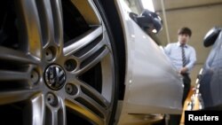 A Volkswagen's logo is seen on a wheel of a car at a used car dealership in Seoul