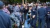 Kazakh police detain a demonstrator during an anti-government protest during the presidential elections in Nur-Sultan, the capital city of Kazakhstan, June 9, 2019. 