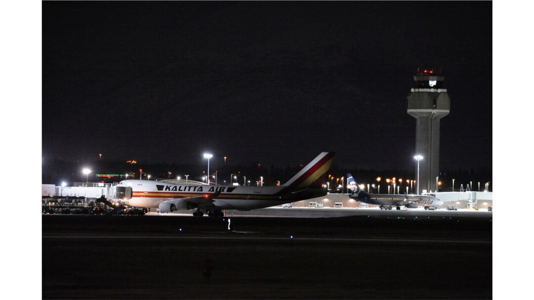 Carrying some 240 American diplomats and citizens, a Boeing 747 aircraft sits on the tarmac in Anchorage, Jan. 28, 2020. Chartered by the U.S. government, the plane flew from Wuhan, China, the source of the coronavirus outbreak.