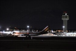 Carrying some 240 American diplomats and citizens, a Boeing 747 aircraft sits on the tarmac in Anchorage, Jan. 28, 2020. Chartered by the U.S. government, the plane flew from Wuhan, China, the source of the coronavirus outbreak.