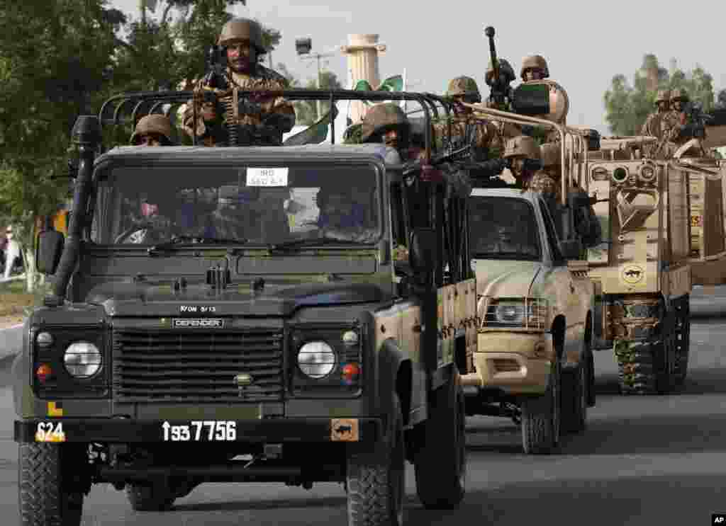 Pakistani army troops arrive in the city after an operation launched against the Taliban in North Waziristan, in Karachi, Pakistan, June 16, 2014.
