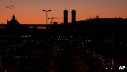 A regional train park near the central station in front of 'church of our lady' in Munich, Germany, Monday, March 16, 2020.