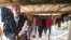 FILE - U.N. special adviser Jan Egeland holds a Syrian baby during his visit to a refugee camp in the town of Marej in the Bekaa valley, east Lebanon, Feb. 25, 2015. 