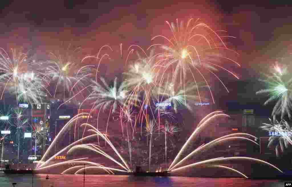 Fireworks explode over Victoria Harbor in Hong Kong to celebrate the Year of the Horse. 