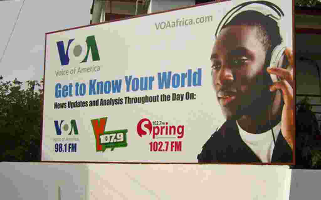 Promoting VOA and affiliate stations on a billboard in Accra, Ghana.