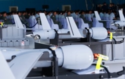 FILE - U.S. ScanEagle drones are lined up for the formal turnover, March 13, 2018, at Villamor Air Base in suburban Pasay city, southeast of Manila, Philippines.