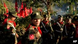 FILE - Officers with the Ta’ang National Liberation Army gather in the steep hillside jungles in Mar Wong, a village in northern Shan state, Myanmar. 