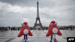 Paris 2024 Olympics (L) and Paralympics mascots "the Phryges" 