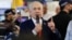 Israeli Prime Minister Benjamin Netanyahu meets members of the public in Ramla (Reuters)