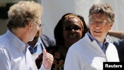 FILE - Bill Gates (R) and former Microsoft chief technology officer and co-founder of Intellectual Ventures Nathan Myhrvold (L) speak while reviewing the displays at the "Reinvent the Toilet Fair" competition at the Bill and Melinda Gates Foundation.