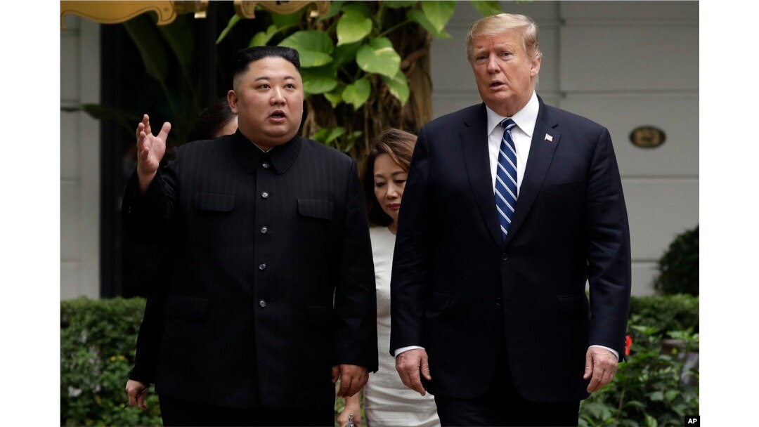 FILE - In this Feb. 28, 2019, file photo, U.S. President Donald Trump and North Korean leader Kim Jong Un take a walk after their first meeting at the Sofitel Legend Metropole Hanoi hotel, in Hanoi, Vietnam.